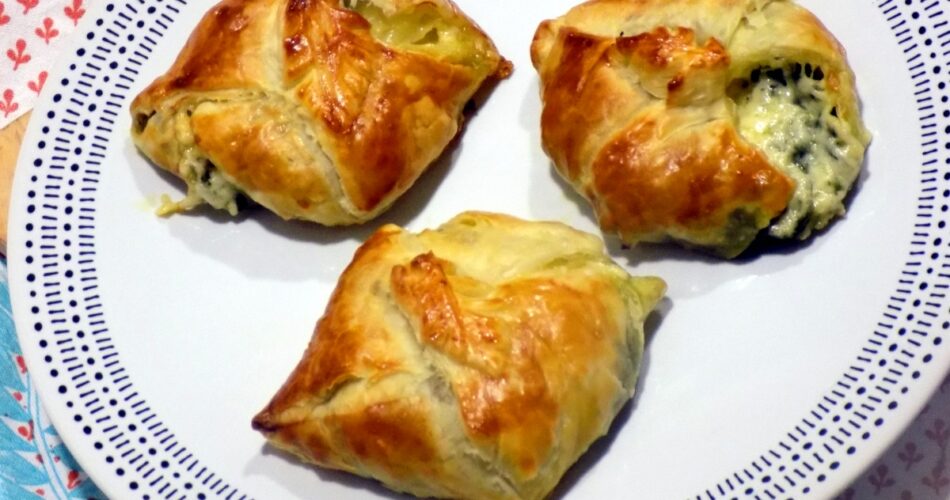 Squares of puff pastry with spinach and feta cheese